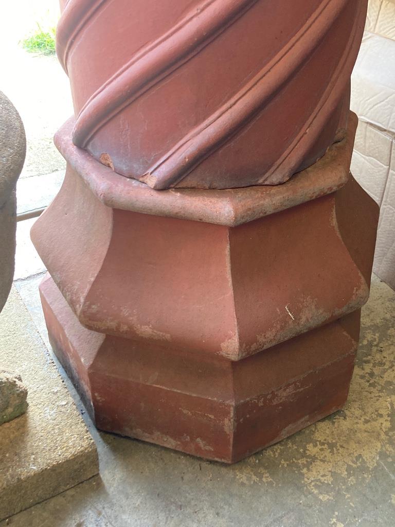 A 19th century Tudor style three-section terracotta chimney pot, height 203cm